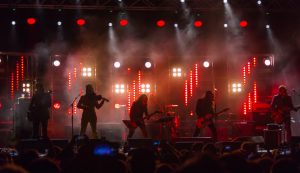 Title image: stage lights concert illuminated with lights intermittently vri colors